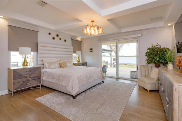 a bedroom with a large bed and a couch