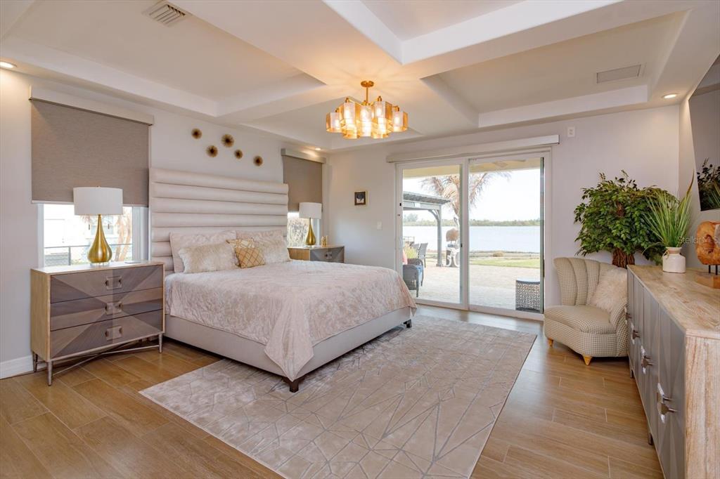 1201 South Riverside Drive Edgewater, FL 32132 - Photo 19 of 47 a bedroom with a large bed and a couch