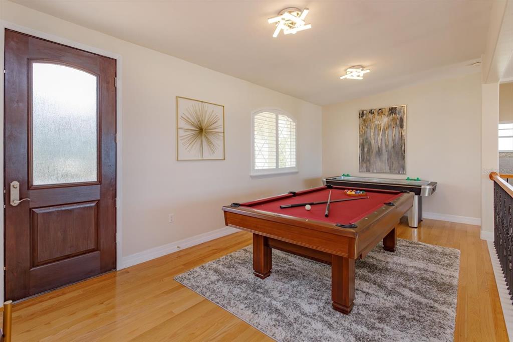 1201 South Riverside Drive Edgewater, FL 32132 - Photo 25 of 47 a room with pool table and windows