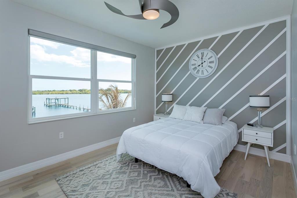 1201 South Riverside Drive Edgewater, FL 32132 - Photo 29 of 47 a bedroom with a bed and a window