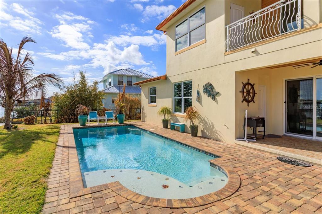 1201 South Riverside Drive Edgewater, FL 32132 - Photo 37 of 47 a view of a house with swimming pool