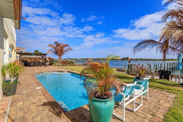 a view of a swimming pool with a patio