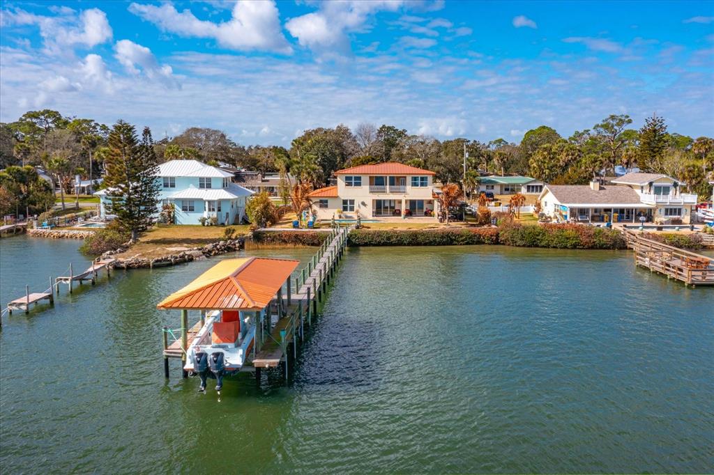 1201 South Riverside Drive Edgewater, FL 32132 - Photo 4 of 47 a view of a lake with houses