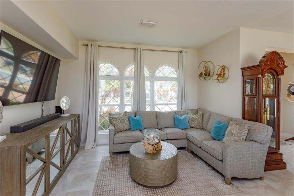 1201 South Riverside Drive Edgewater, FL 32132 - Photo 6 of 47 a living room with furniture and a flat screen tv