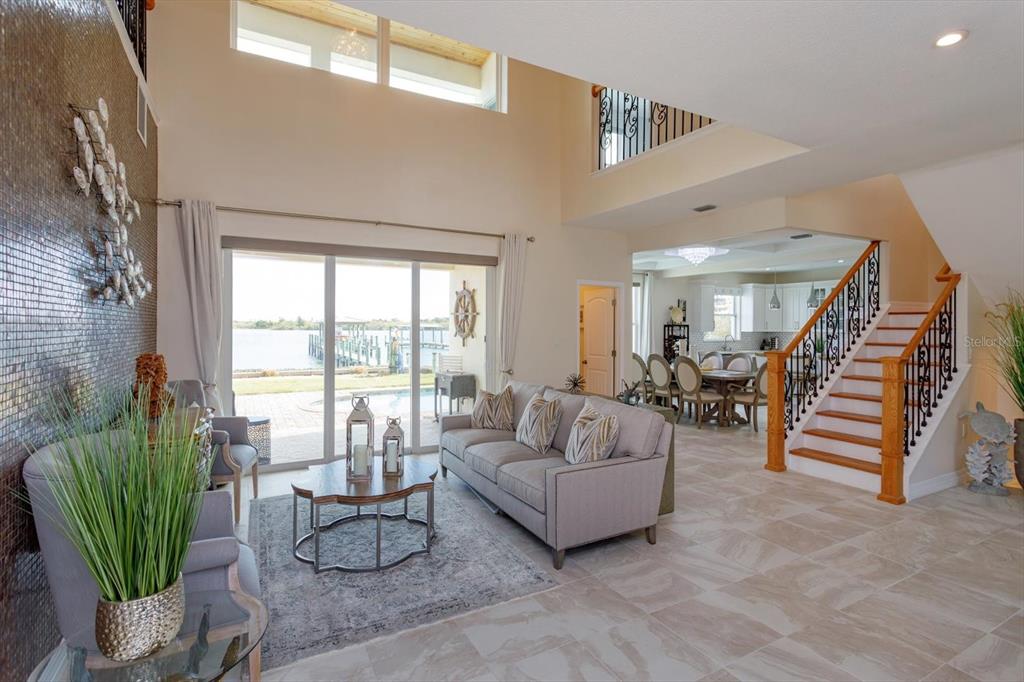 1201 South Riverside Drive Edgewater, FL 32132 - Photo 10 of 47 a living room with furniture and a potted plant