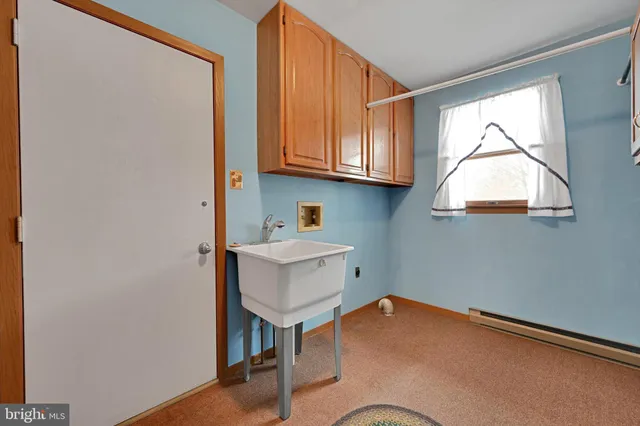 a workspace with furniture and a window