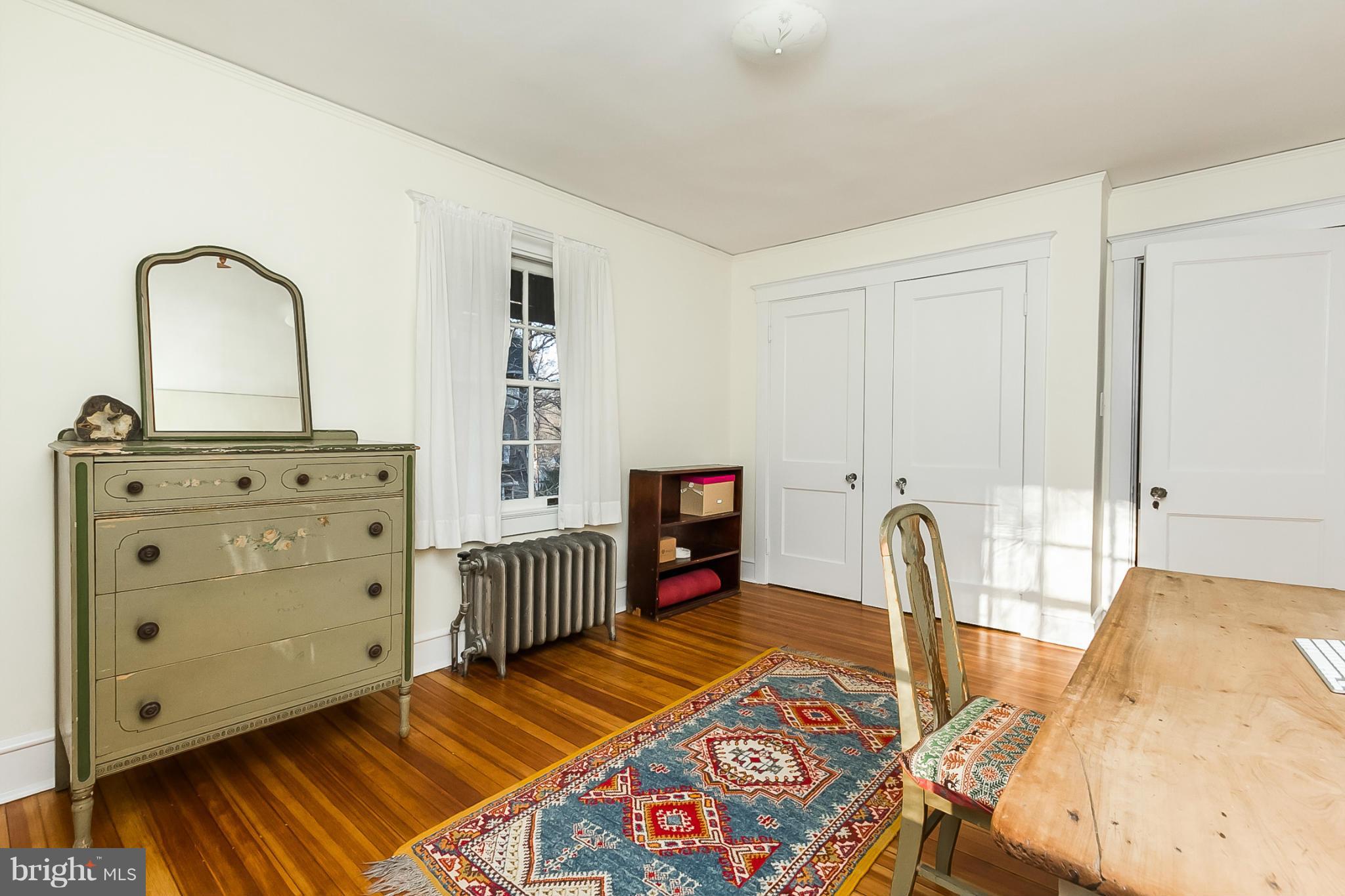 4709 Keswick Road Baltimore, MD 21210 - Photo 20 of 30 a living room with furniture a flat screen tv and a fireplace