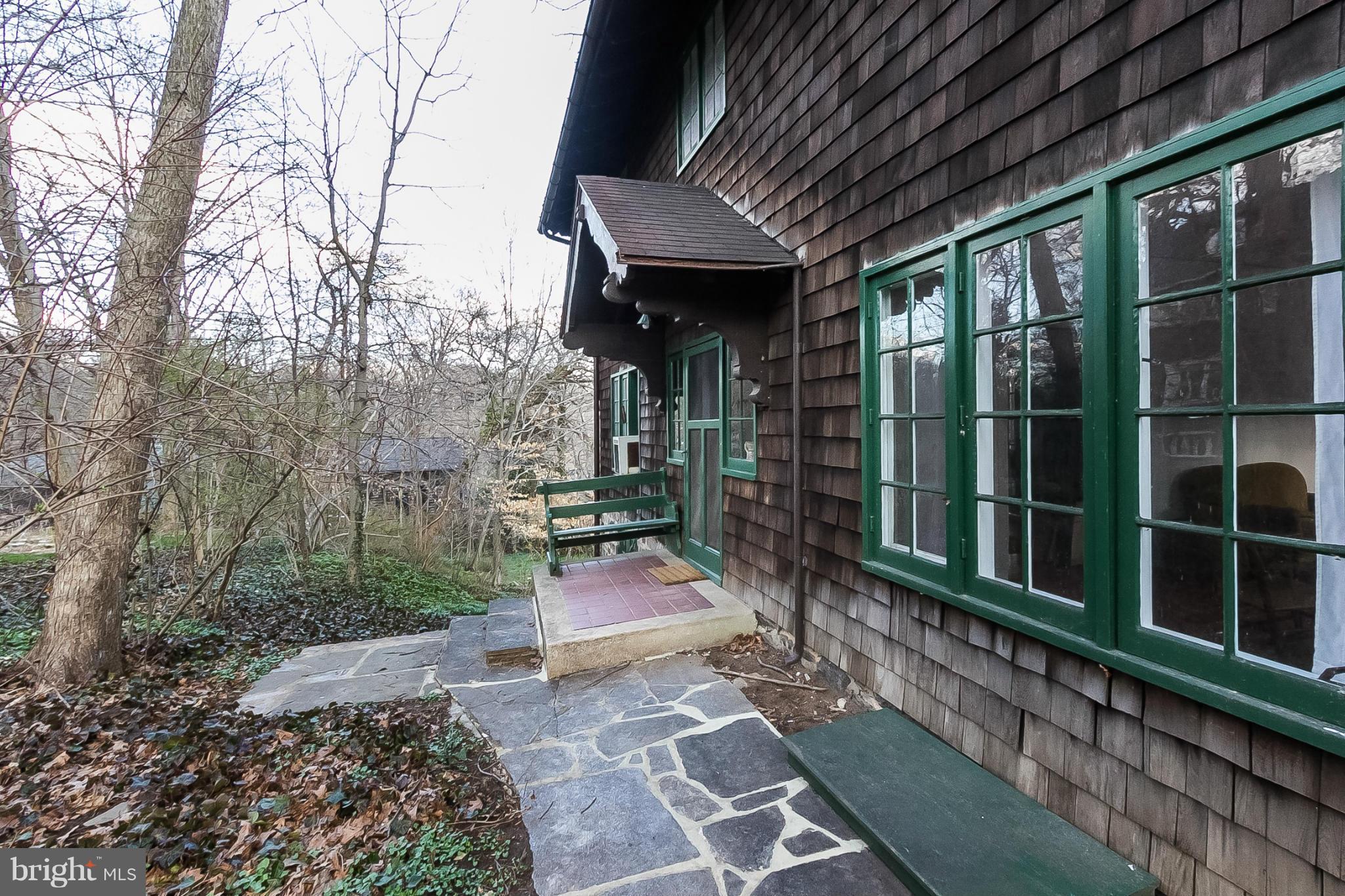 4709 Keswick Road Baltimore, MD 21210 - Photo 3 of 30 a view of a porch with a table and chairs