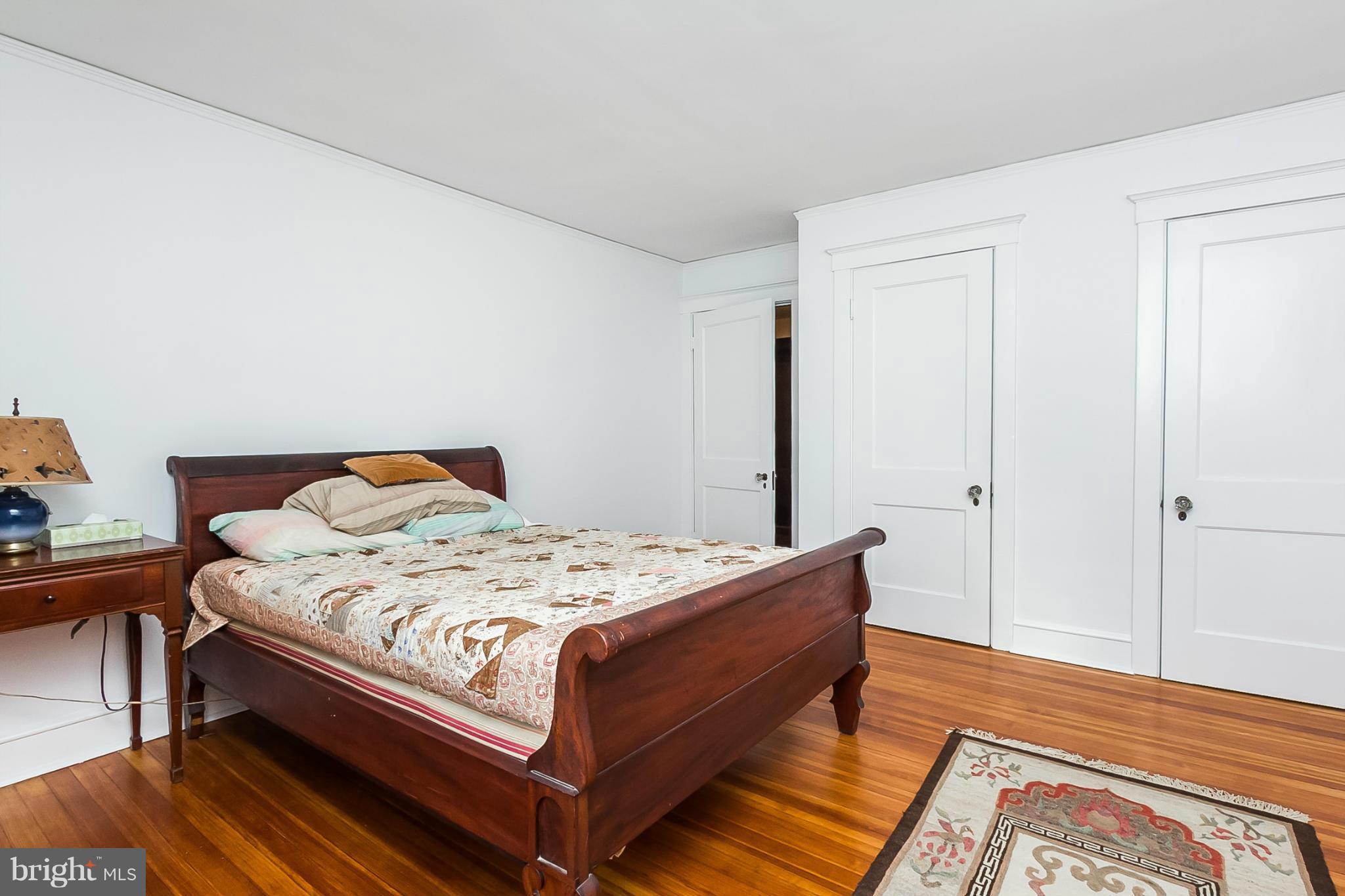 4709 Keswick Road Baltimore, MD 21210 - Photo 22 of 30 a bed sitting in a bedroom next to a window