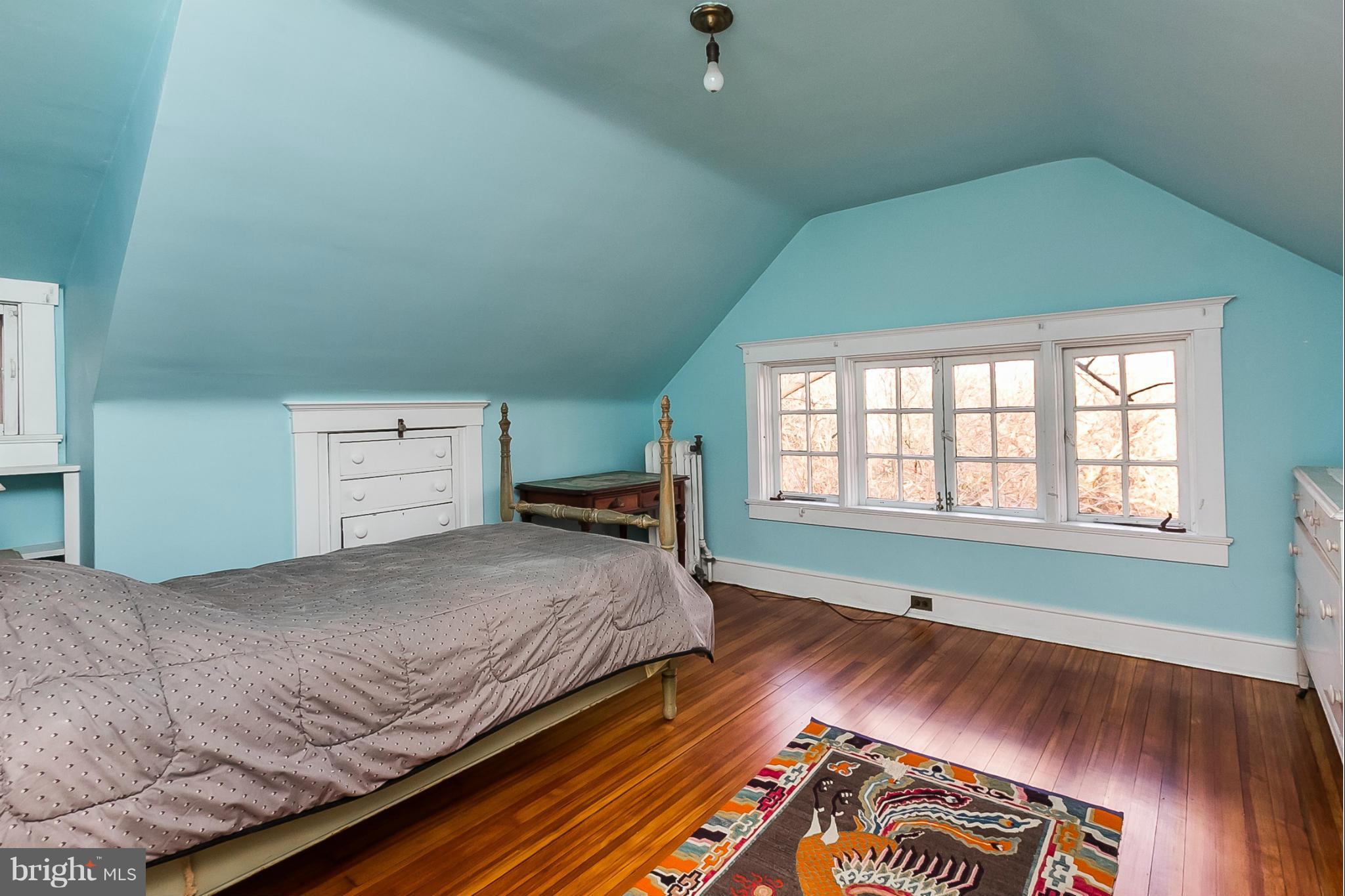 4709 Keswick Road Baltimore, MD 21210 - Photo 26 of 30 a bedroom with a bed and a window