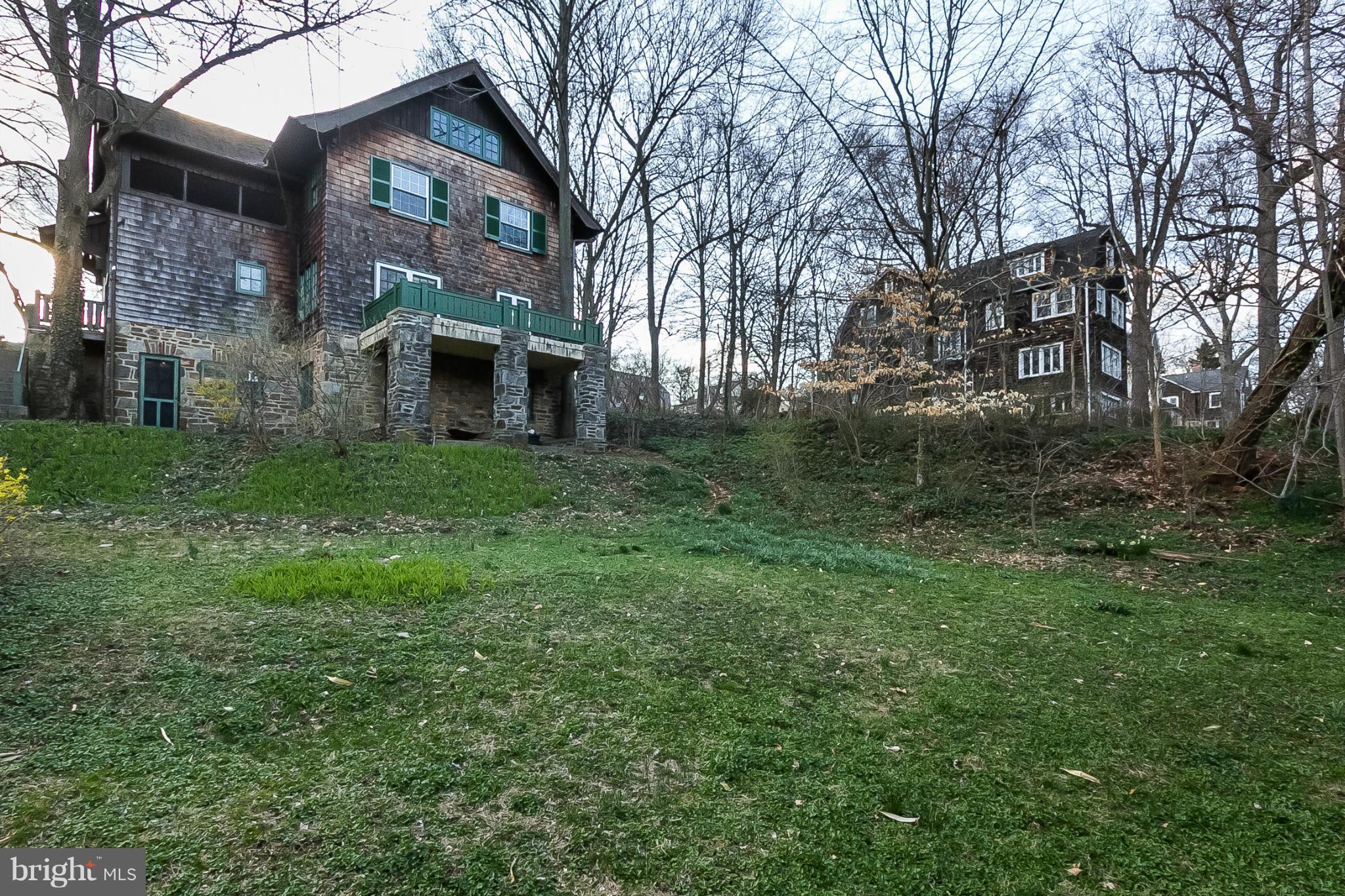 4709 Keswick Road Baltimore, MD 21210 - Photo 30 of 30 a view of a brick house with a yard