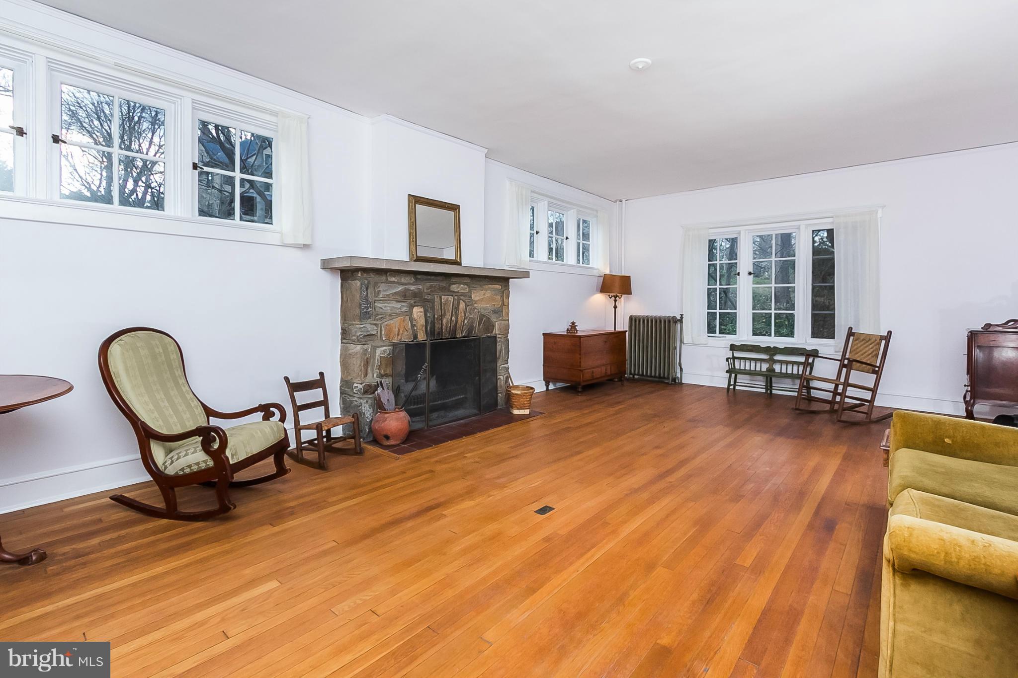 4709 Keswick Road Baltimore, MD 21210 - Photo 6 of 30 a living room with furniture and a fireplace