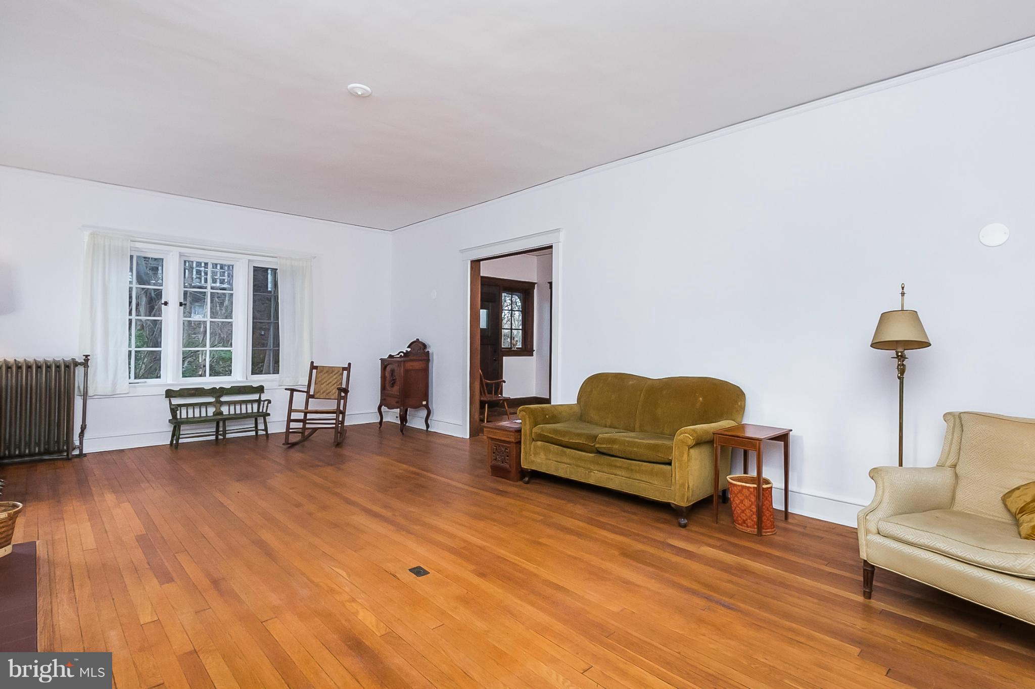 4709 Keswick Road Baltimore, MD 21210 - Photo 7 of 30 a living room with furniture and a couch with wooden floor