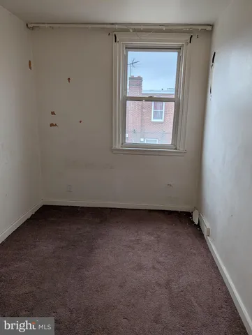 a view of a room that has a small window in it