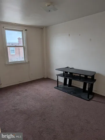 a view of workspace with furniture and window