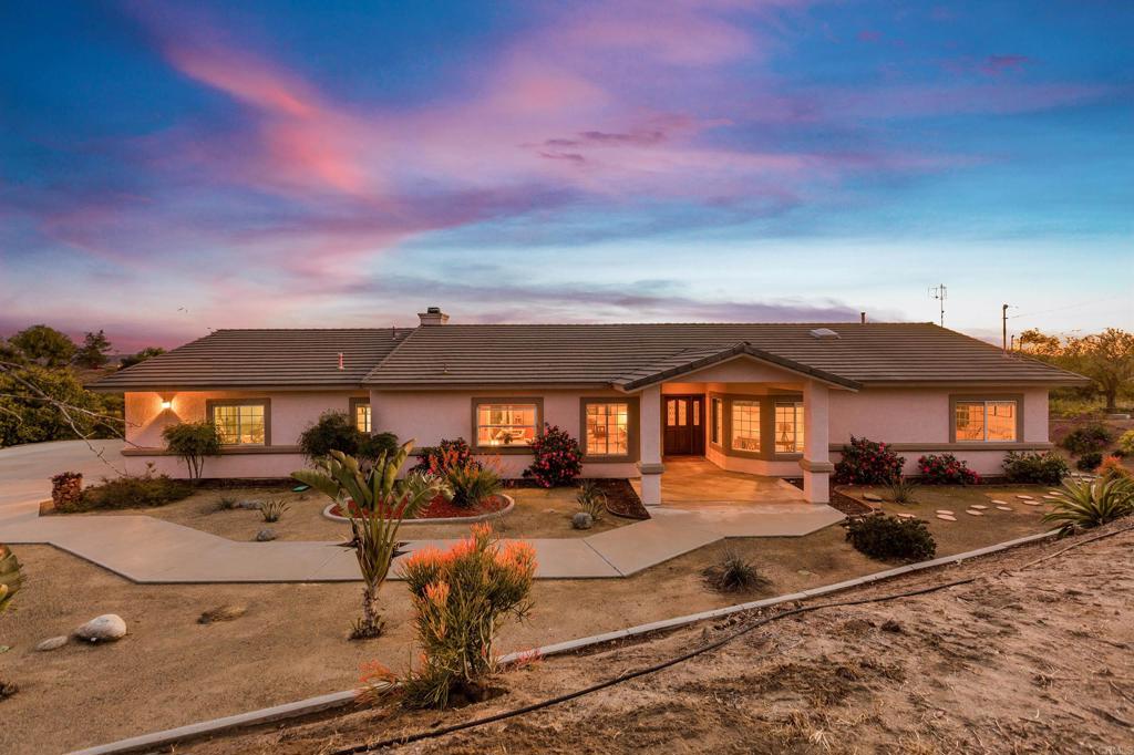 29076 Sunset Road Valley Center, CA 92082 - Photo 1 of 65 a view of a building with a yard