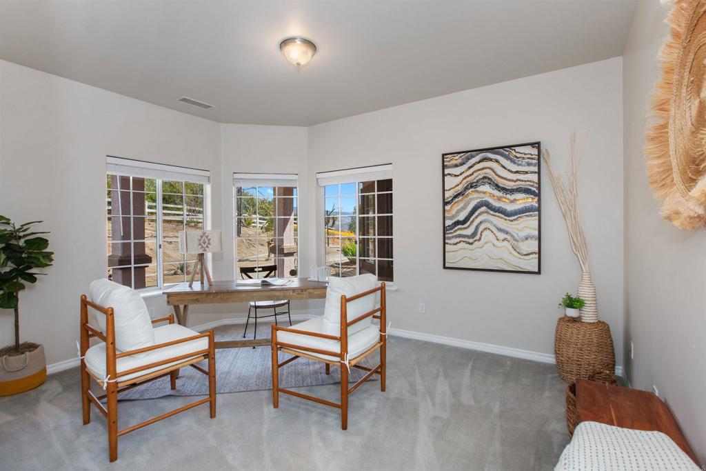 29076 Sunset Road Valley Center, CA 92082 - Photo 29 of 65 a living room with furniture and a potted plant