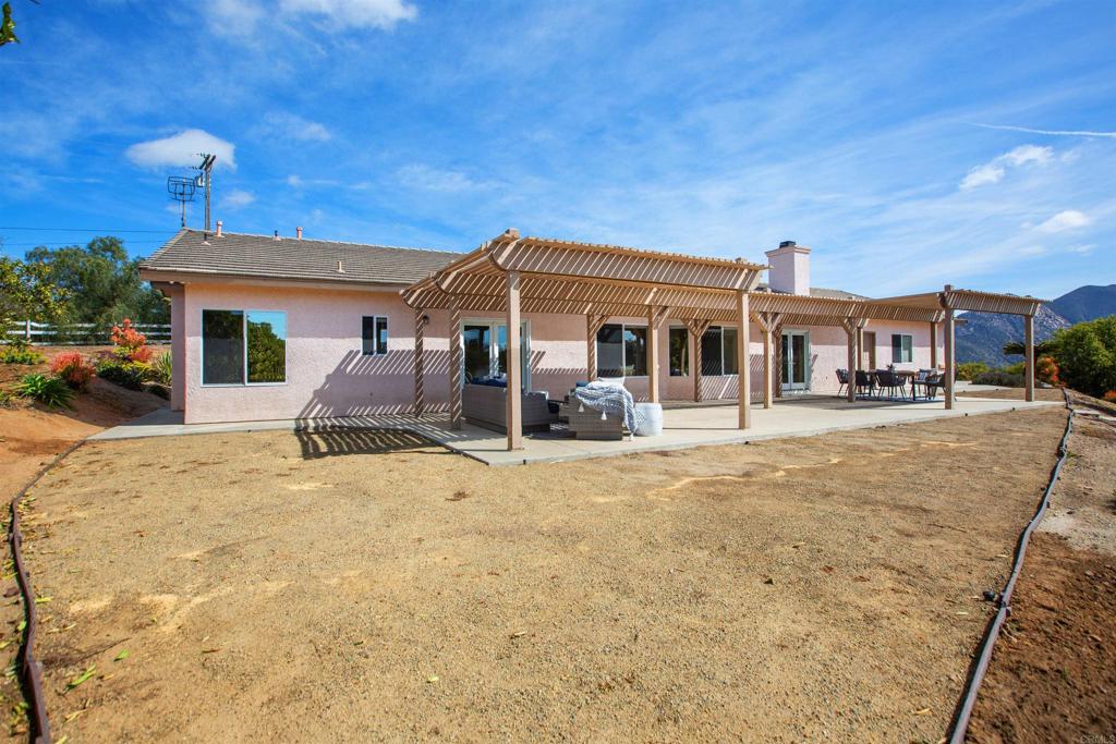 29076 Sunset Road Valley Center, CA 92082 - Photo 41 of 65 a front view of a house with a yard
