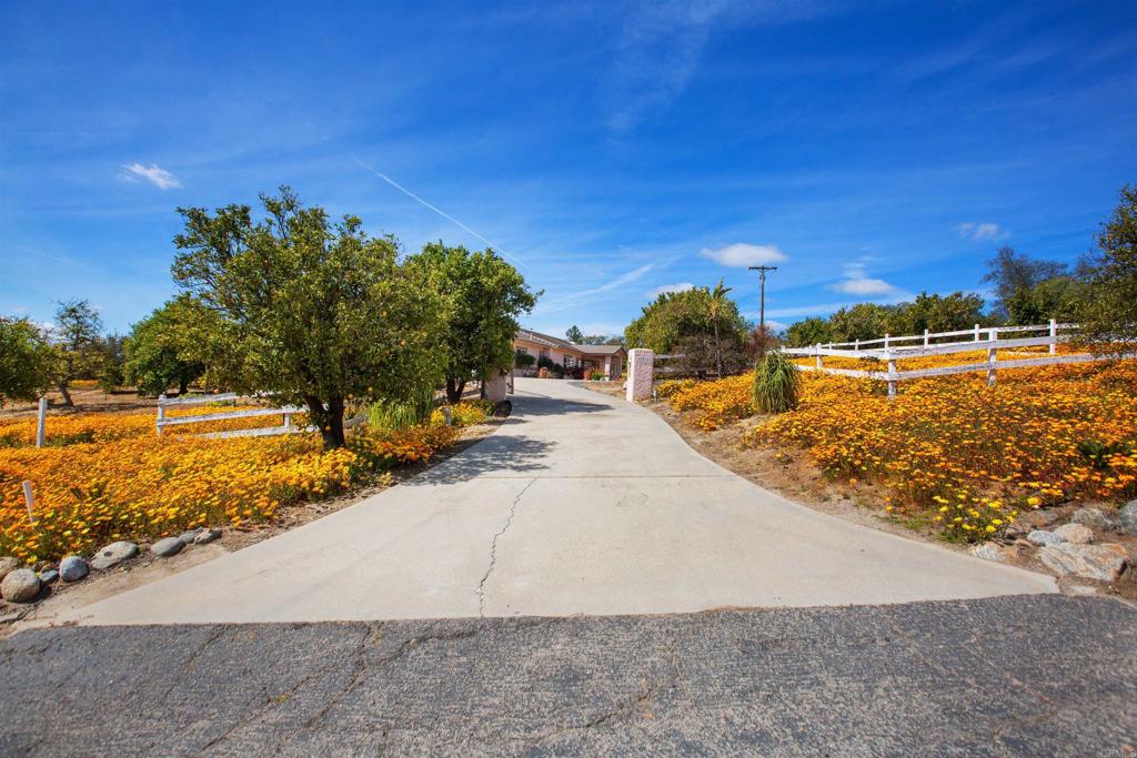 29076 Sunset Road Valley Center, CA 92082 - Photo 55 of 65 a view of a swimming pool with an outdoor space and seating area