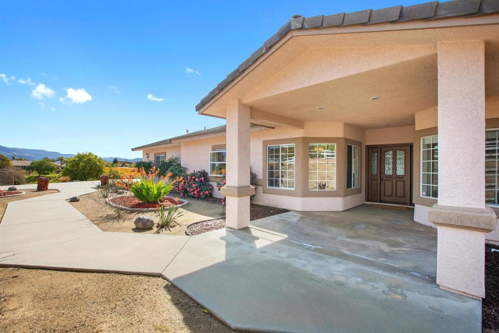 29076 Sunset Road Valley Center, CA 92082 - Photo 63 of 65 a view of a house with backyard and sitting area