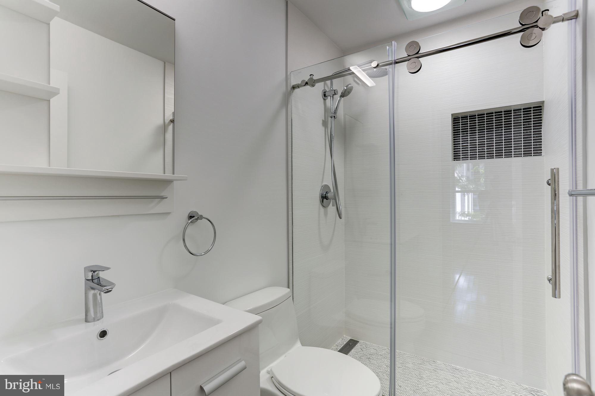 1325 13th Street Northwest, Unit 24 Washington, DC 20005 - Photo 13 of 30 a bathroom with a sink toilet and shower