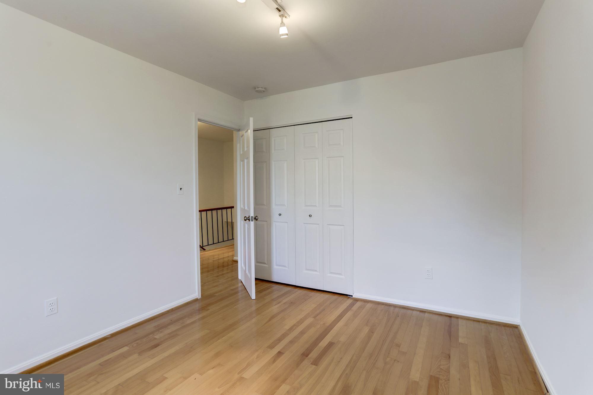 1325 13th Street Northwest, Unit 24 Washington, DC 20005 - Photo 16 of 30 a view of an empty room with wooden floor