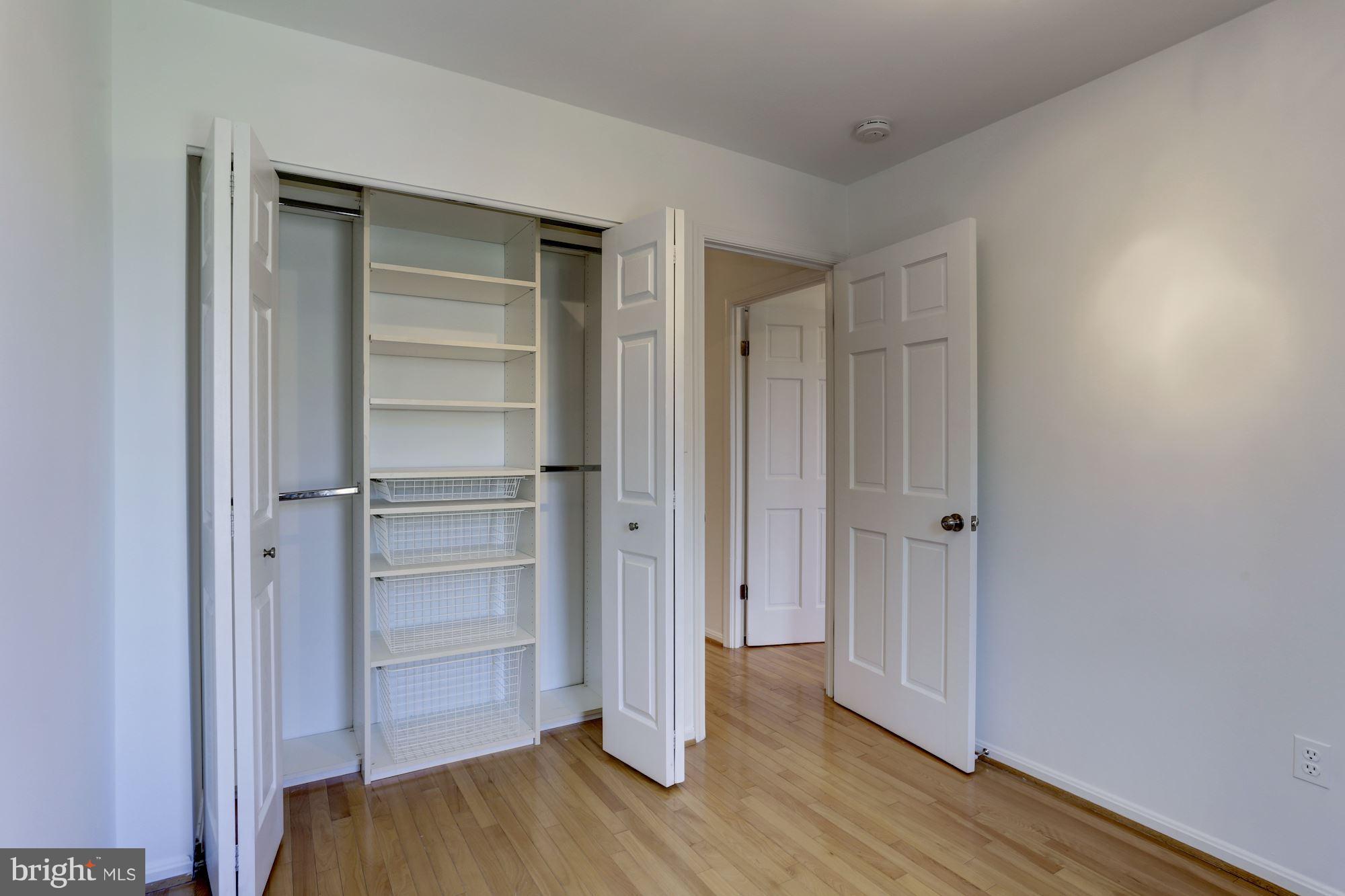 1325 13th Street Northwest, Unit 24 Washington, DC 20005 - Photo 17 of 30 a view of walk in closet with empty racks