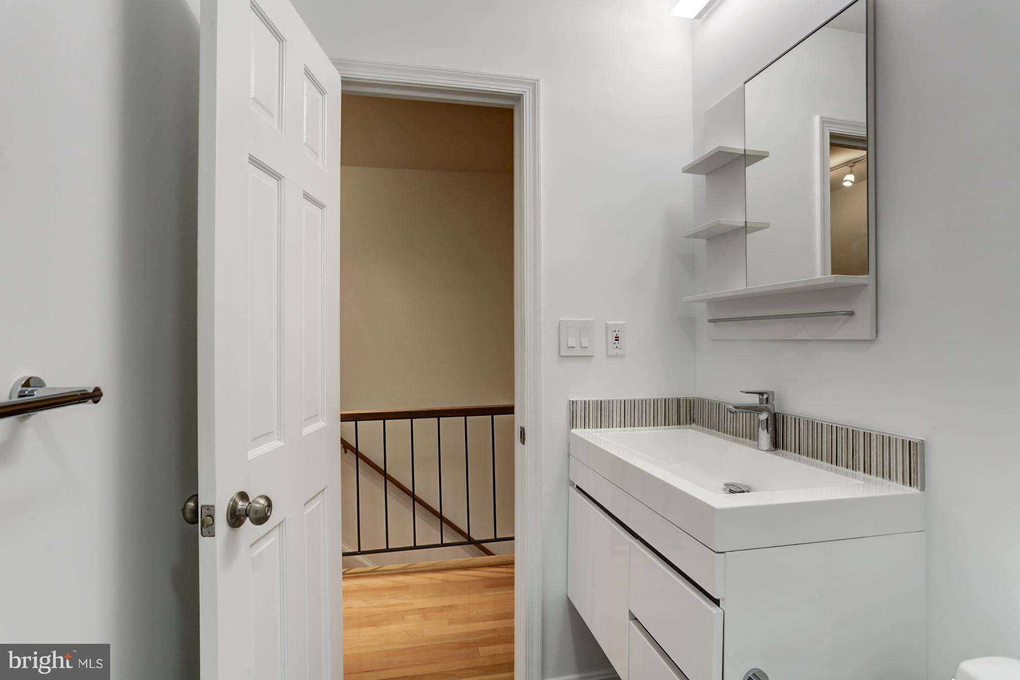 1325 13th Street Northwest, Unit 24 Washington, DC 20005 - Photo 19 of 30 a bathroom with a sink and mirror