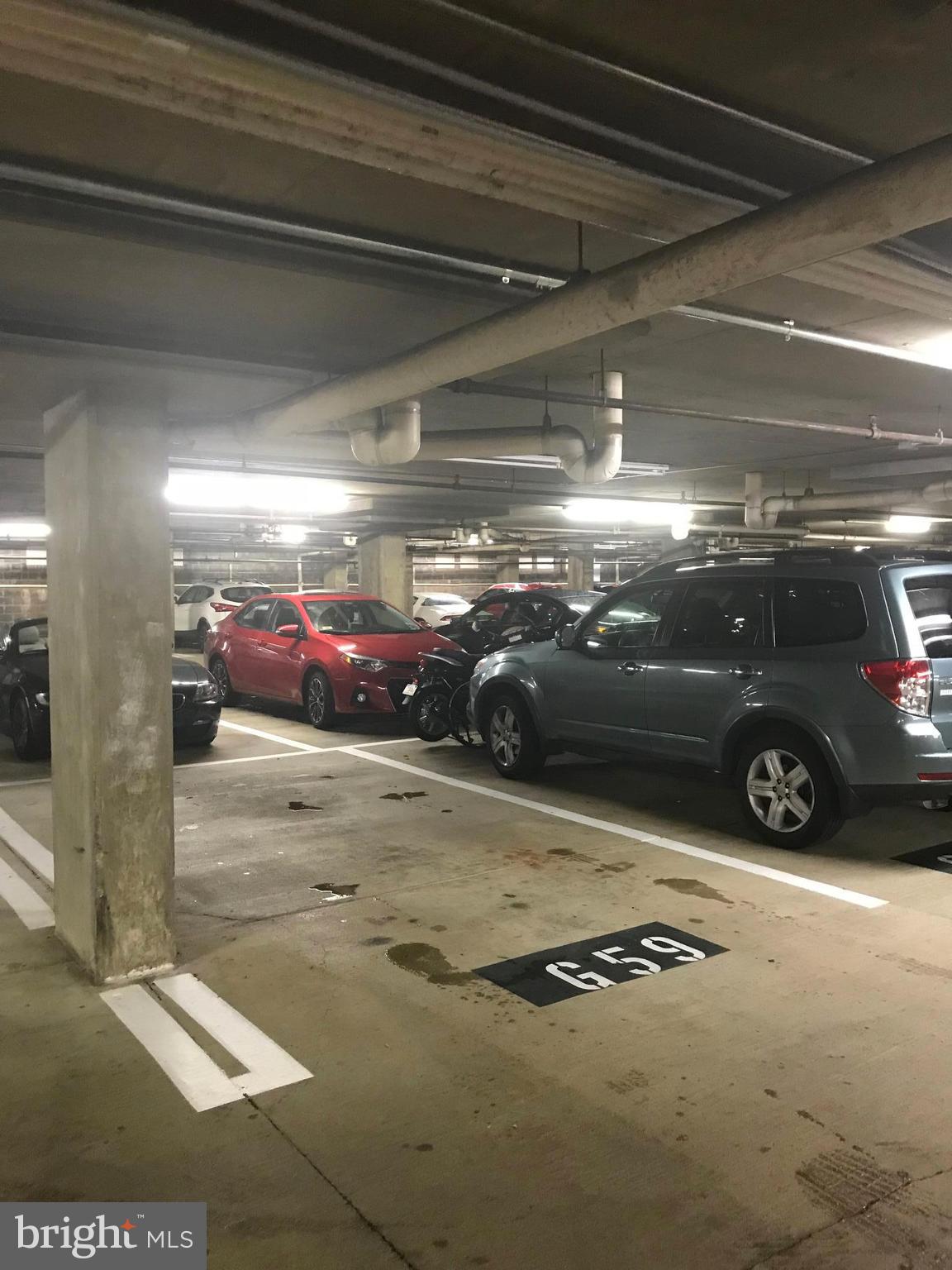 1325 13th Street Northwest, Unit 24 Washington, DC 20005 - Photo 21 of 30 a view of parking garage with cars parked