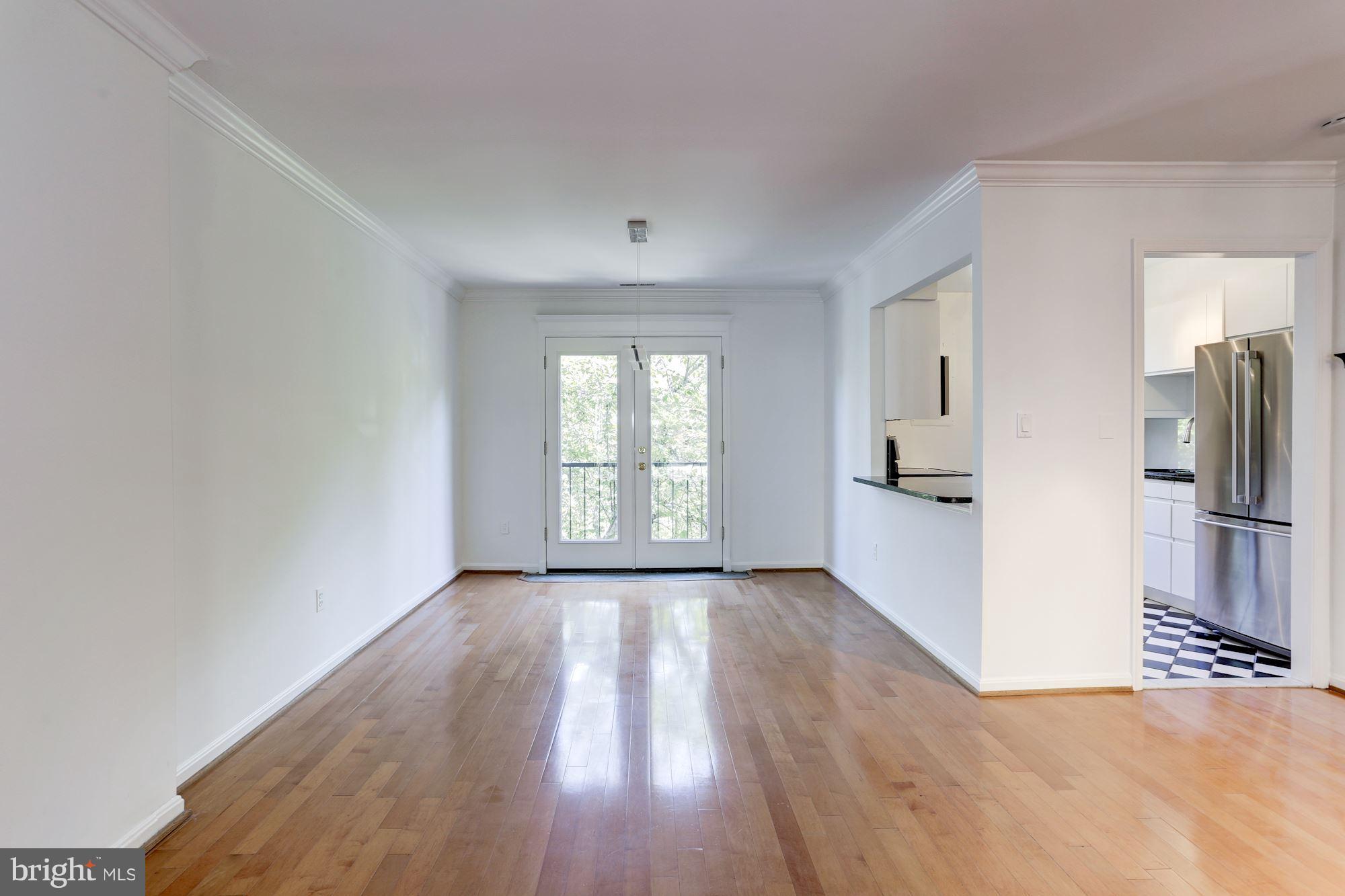 1325 13th Street Northwest, Unit 24 Washington, DC 20005 - Photo 6 of 30 a view of a kitchen with wooden floor and a kitchen