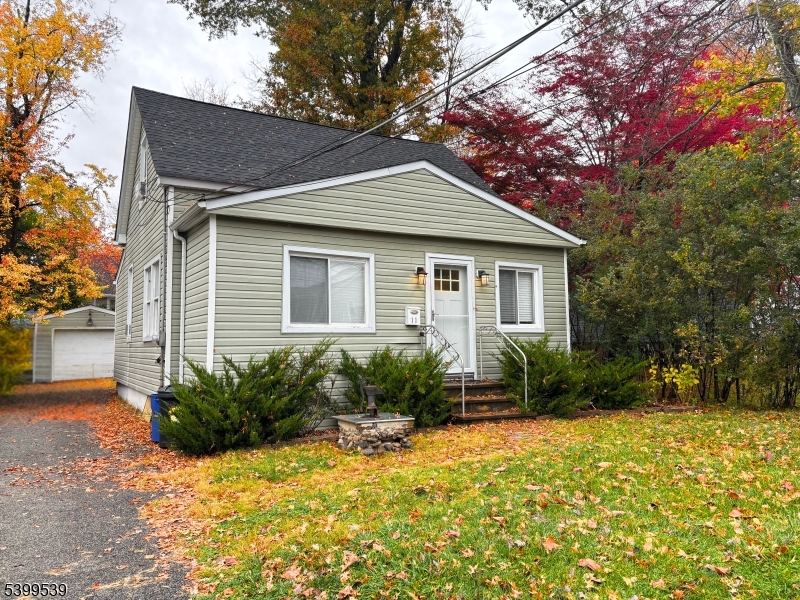 11 Garfield Road Parsippany, NJ 07054 - Photo 2 of 8 a front view of a house with garden