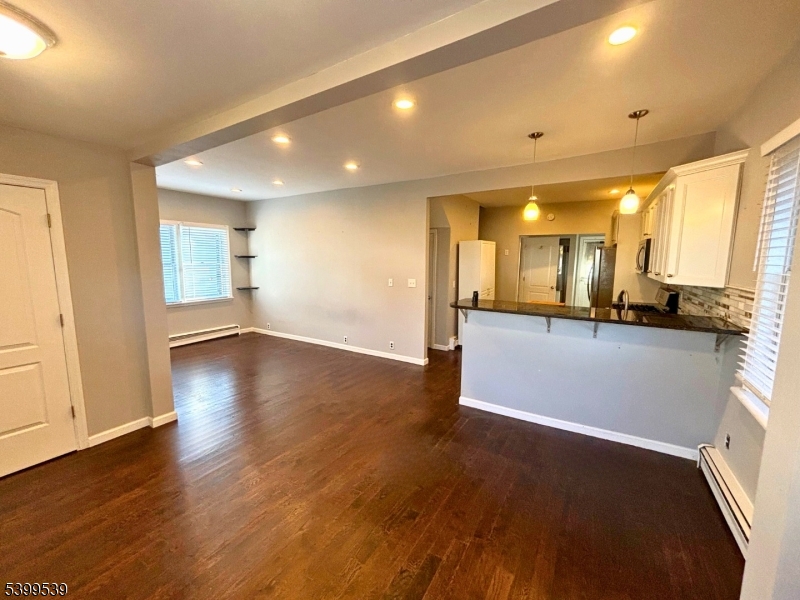 11 Garfield Road Parsippany, NJ 07054 - Photo 4 of 8 a view of a kitchen with a sink and a stove top oven