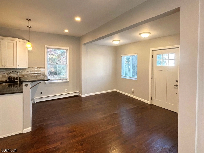 11 Garfield Road Parsippany, NJ 07054 - Photo 7 of 8 a view of an empty room with a window and wooden floor