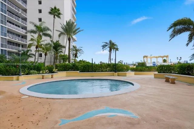 a view of a swimming pool with a table and chairs