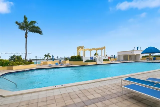 a view of a swimming pool with a chair