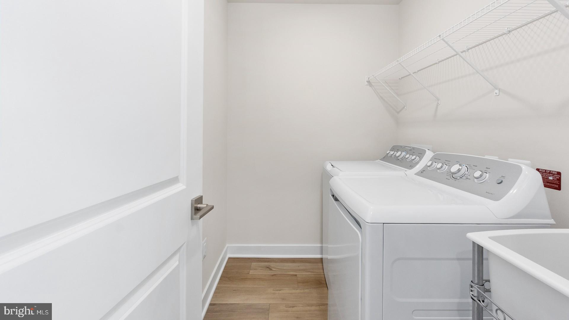 44588 Strabane Terrace Ashburn, VA 20147 - Photo 23 of 26 a utility room with dryer and washer