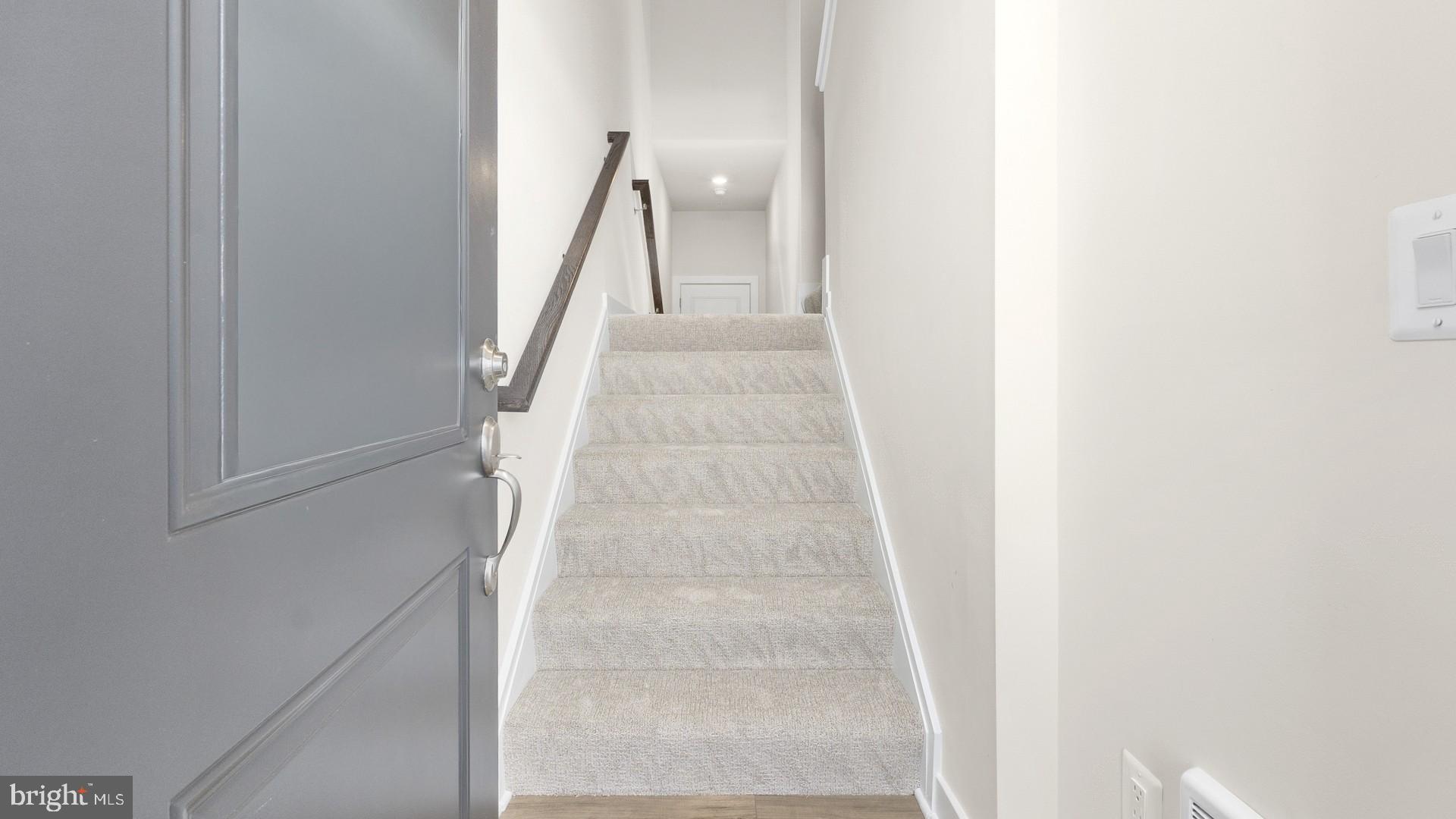 44588 Strabane Terrace Ashburn, VA 20147 - Photo 25 of 26 a view of staircase with white walls