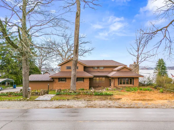 a front view of a house with garden