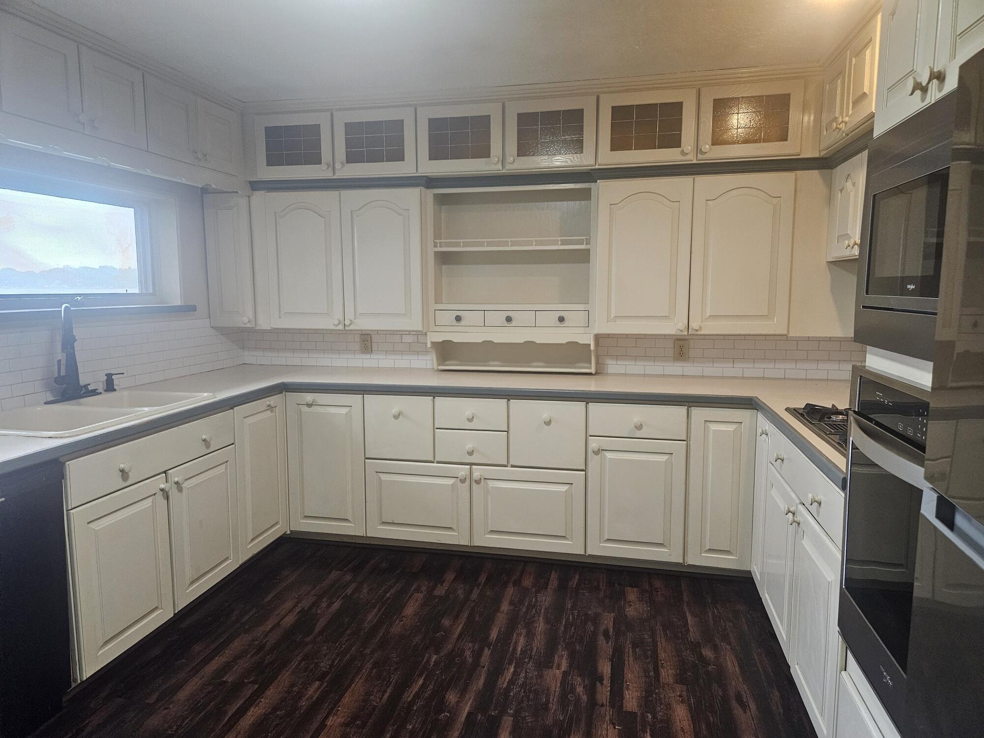 683 Waverly Road La Porte, IN 46350 - Photo 19 of 54 a kitchen with cabinets stove and a sink