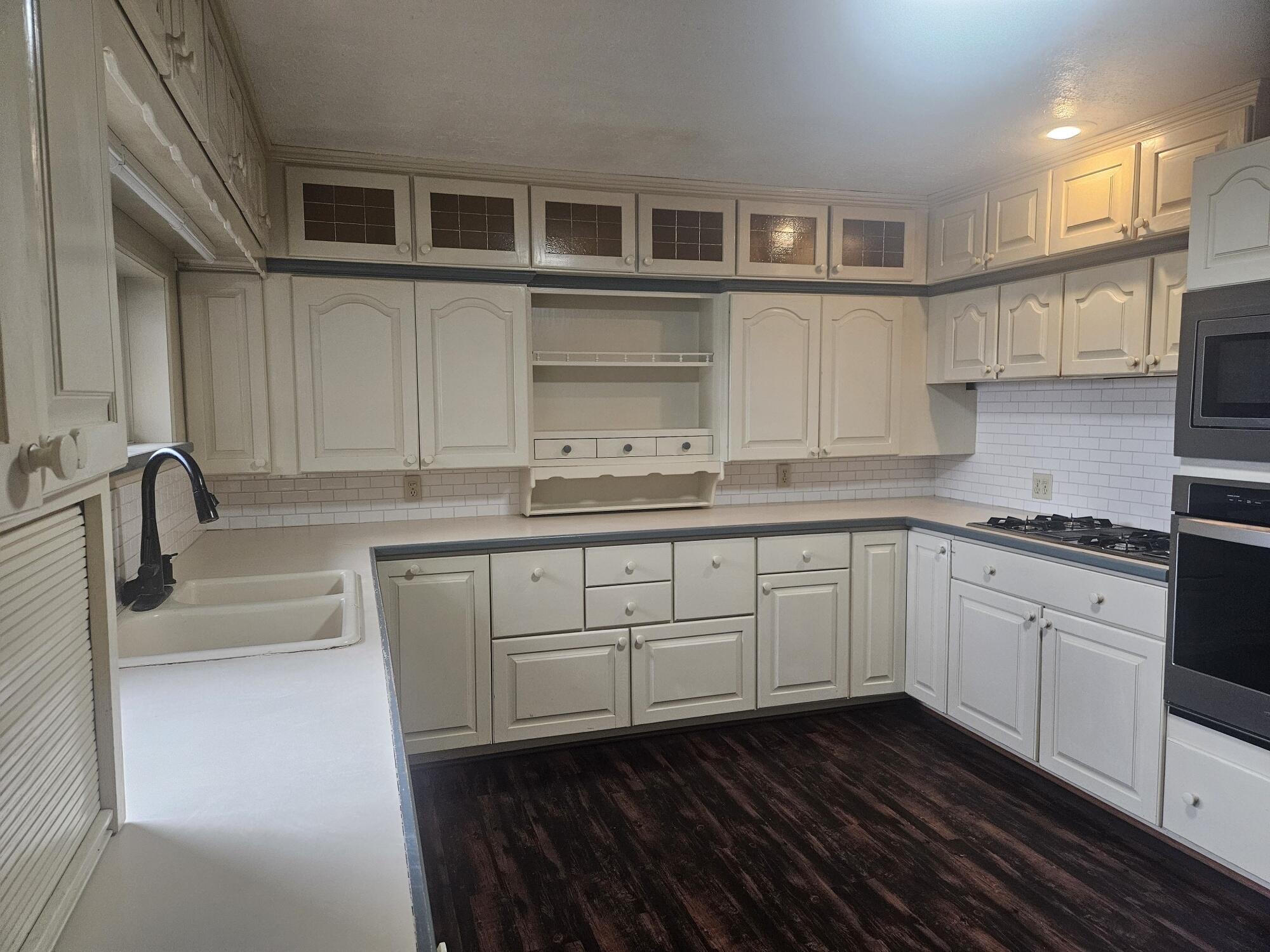 683 Waverly Road La Porte, IN 46350 - Photo 21 of 54 a kitchen with cabinets stainless steel appliances and a sink
