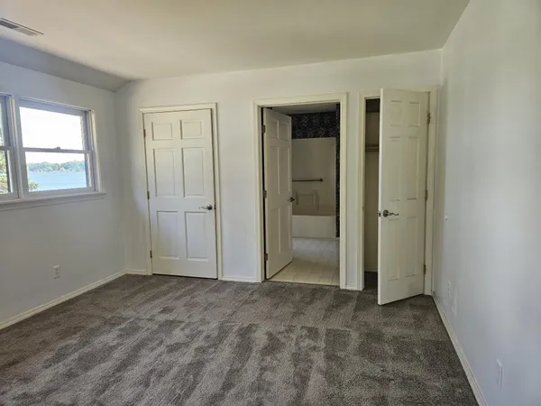 a view of a house with a yard and deck