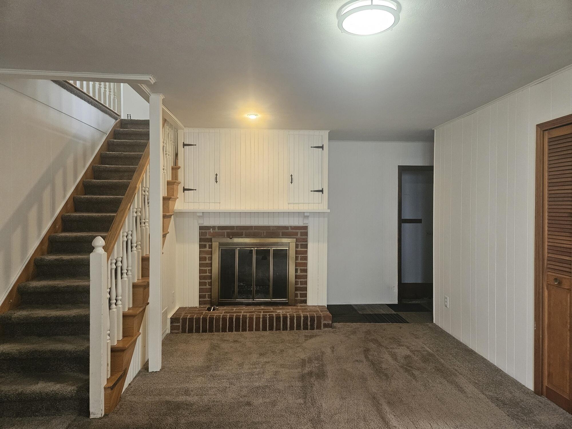683 Waverly Road La Porte, IN 46350 - Photo 29 of 54 an empty room with wooden floor entryway and windows
