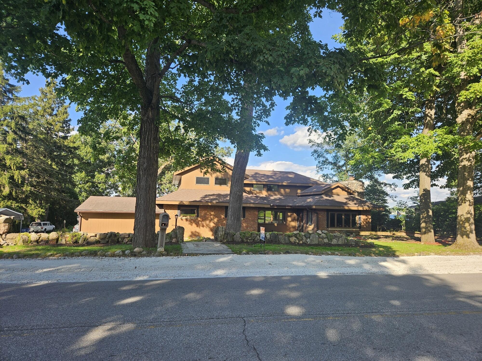 683 Waverly Road La Porte, IN 46350 - Photo 3 of 54 a front view of a building with tree s