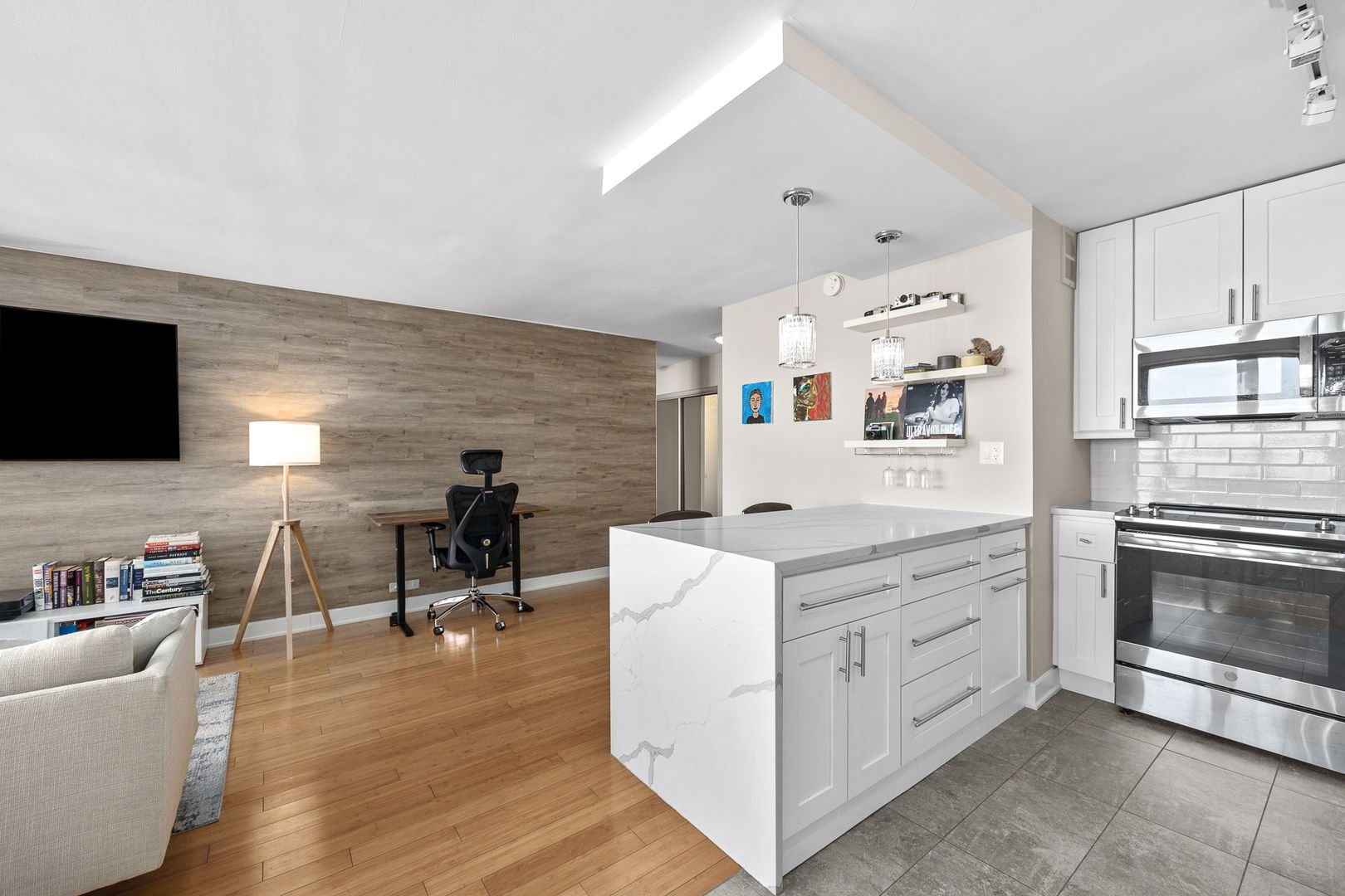 655 West Irving Park Road, Unit 3708 Chicago, IL 60613 - Photo 15 of 55 a kitchen with cabinets and wooden floor