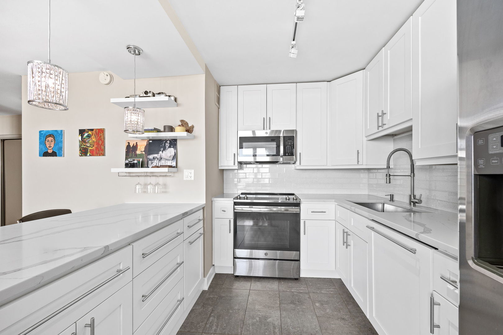 655 West Irving Park Road, Unit 3708 Chicago, IL 60613 - Photo 16 of 55 a kitchen with cabinets and window