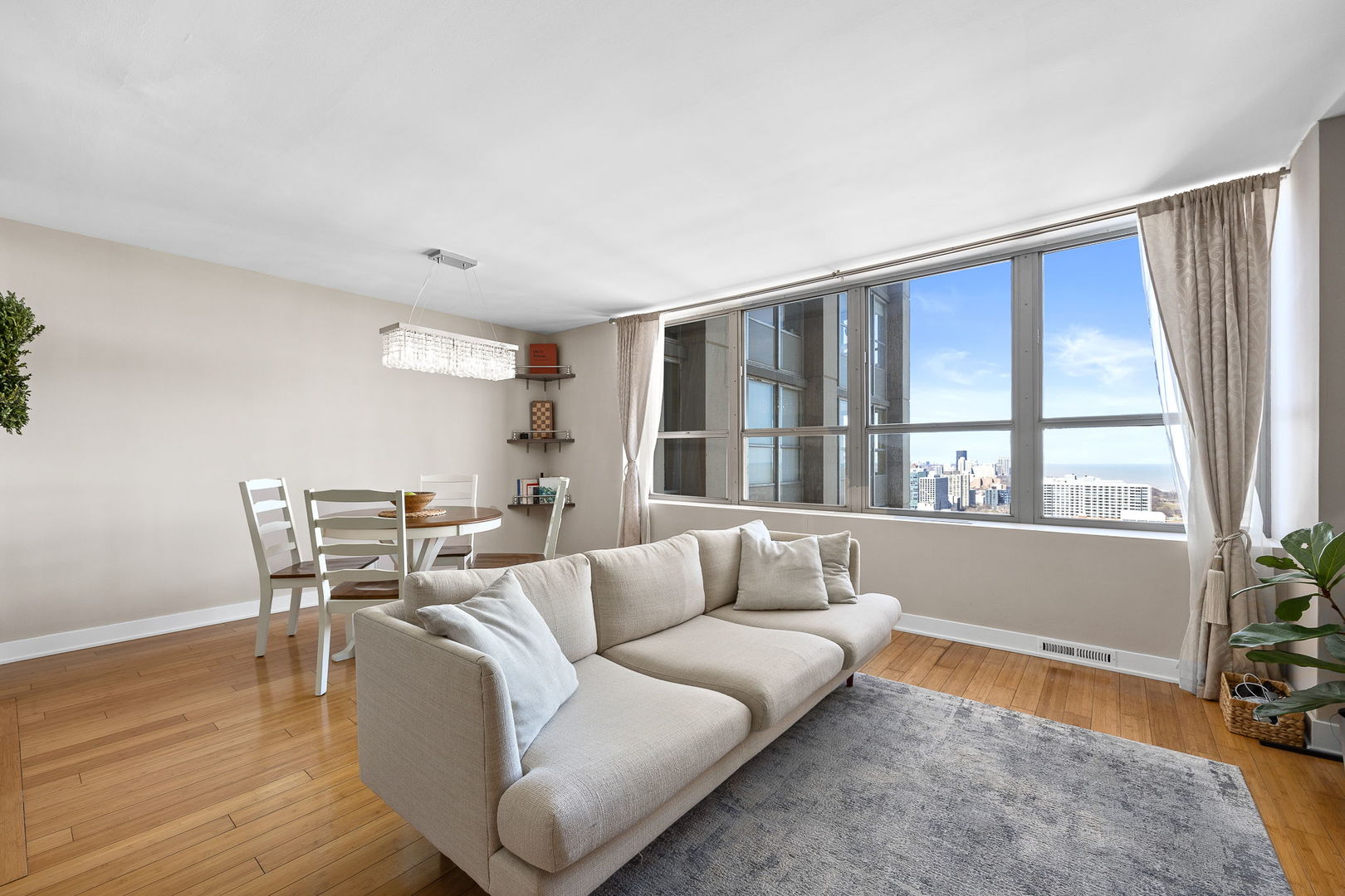 655 West Irving Park Road, Unit 3708 Chicago, IL 60613 - Photo 20 of 55 a living room with furniture and a window