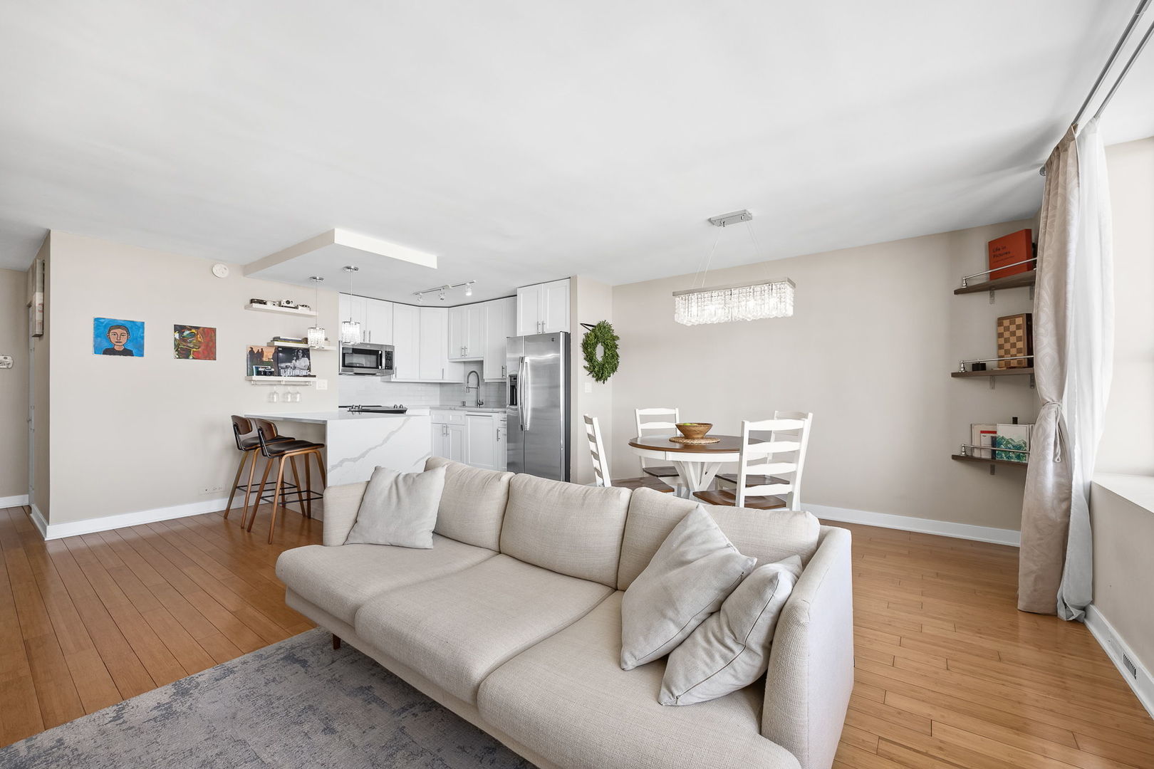 655 West Irving Park Road, Unit 3708 Chicago, IL 60613 - Photo 21 of 55 a living room with furniture and a wooden floor