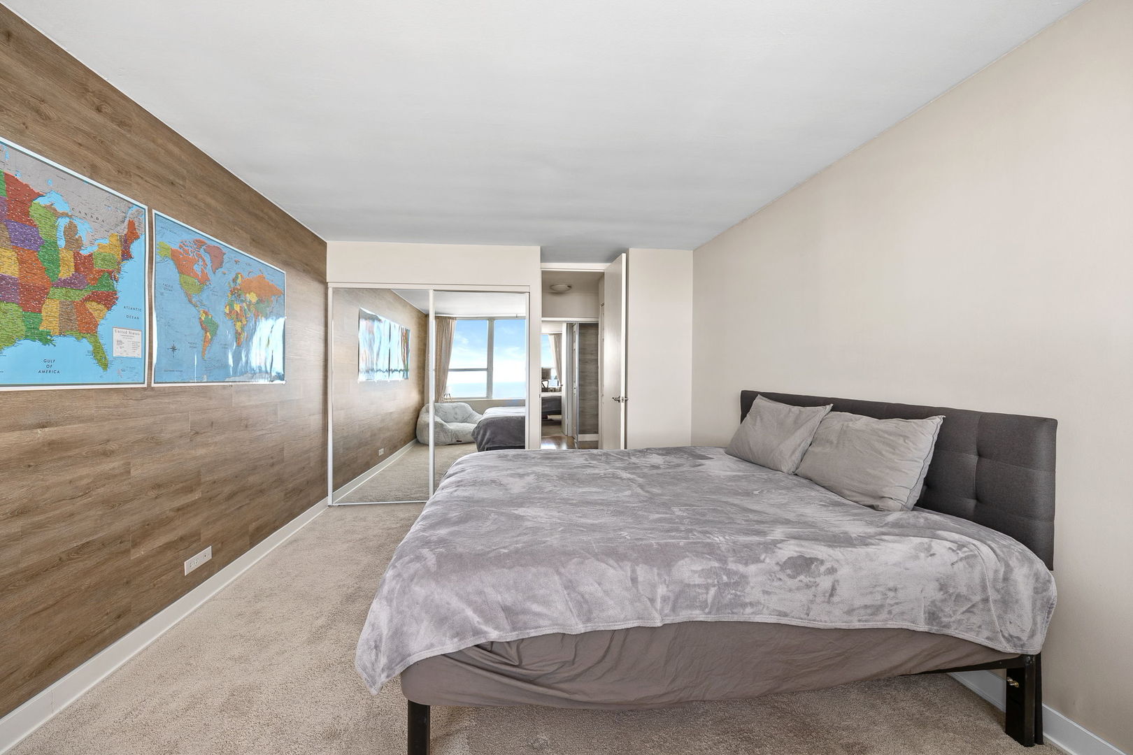 655 West Irving Park Road, Unit 3708 Chicago, IL 60613 - Photo 26 of 55 a large bed sitting in a bedroom next to a window