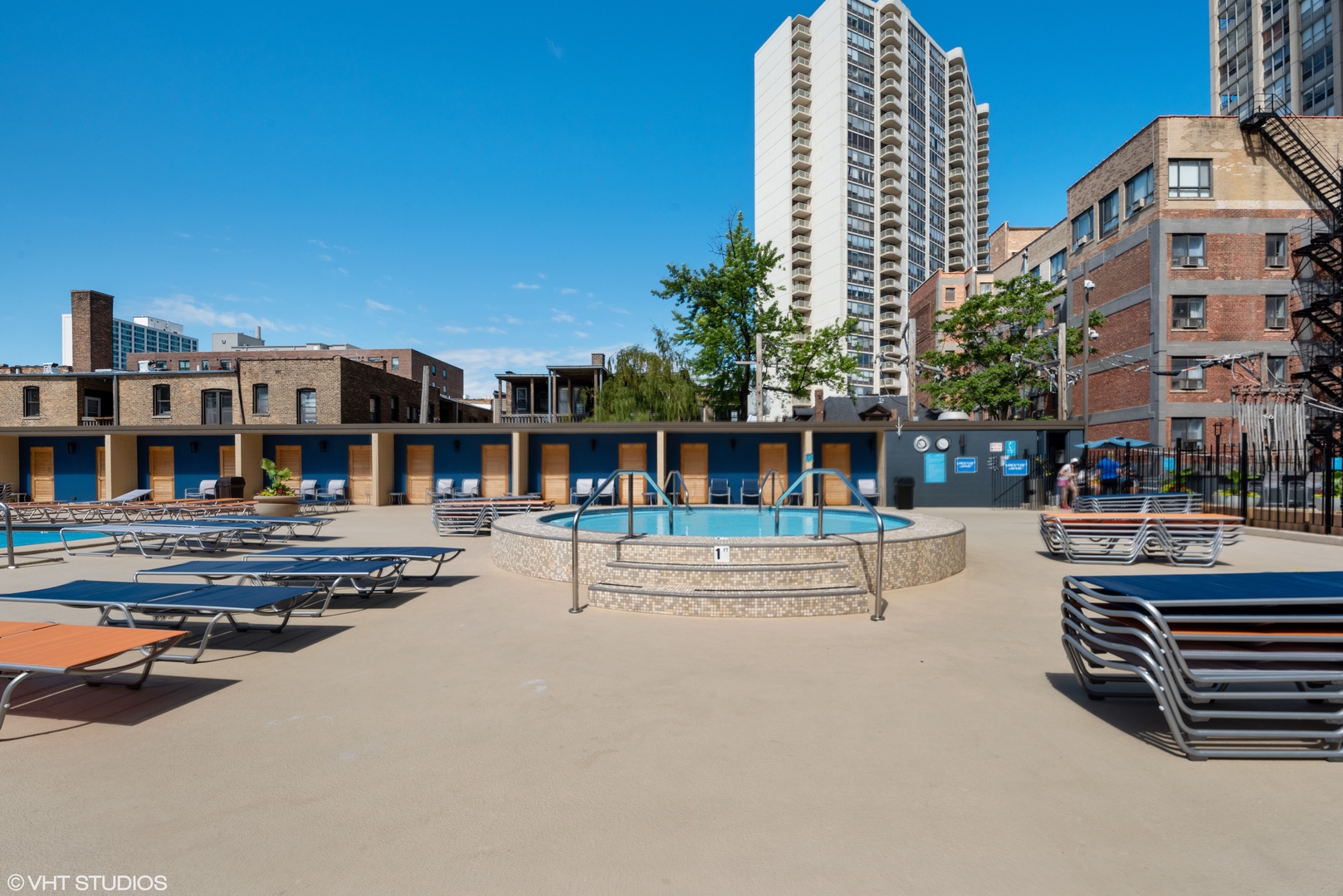 655 West Irving Park Road, Unit 3708 Chicago, IL 60613 - Photo 38 of 55 a view of a swimming pool with a lounge chairs