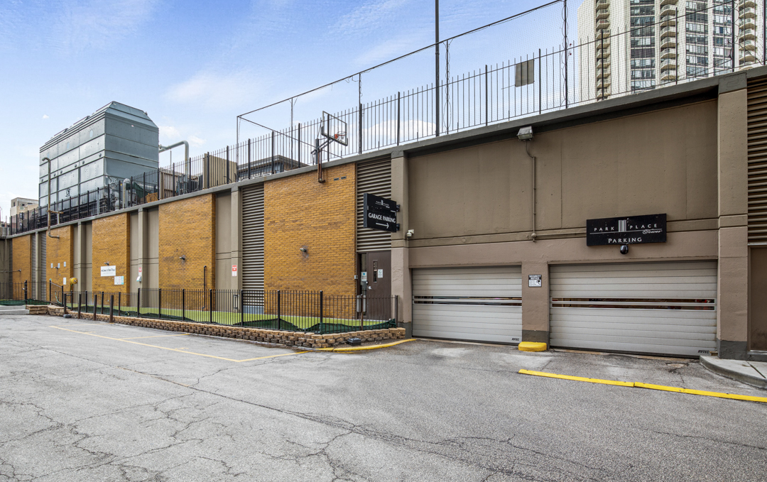 655 West Irving Park Road, Unit 3708 Chicago, IL 60613 - Photo 51 of 55 a view of a street with wooden fence